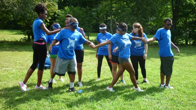 a group doing an outdoor team building activity 
